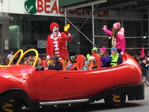 Ronald McDonald, the world's most famous clown, is riding down the Parade route in his one of a kind Big Red Shoe Car.