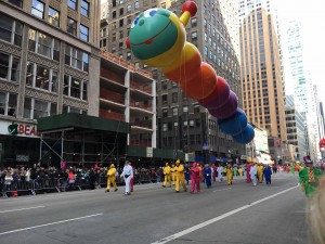 Novelty Balloon the handlers obey the request of the parade viewers to "bounce the balloon."